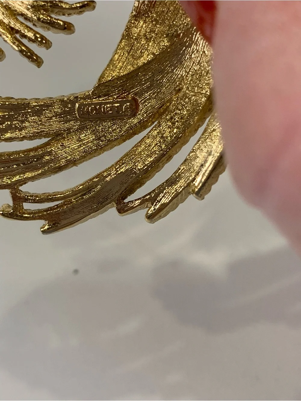 Vintage Monet Gold Tone Textured Swirl Brooch